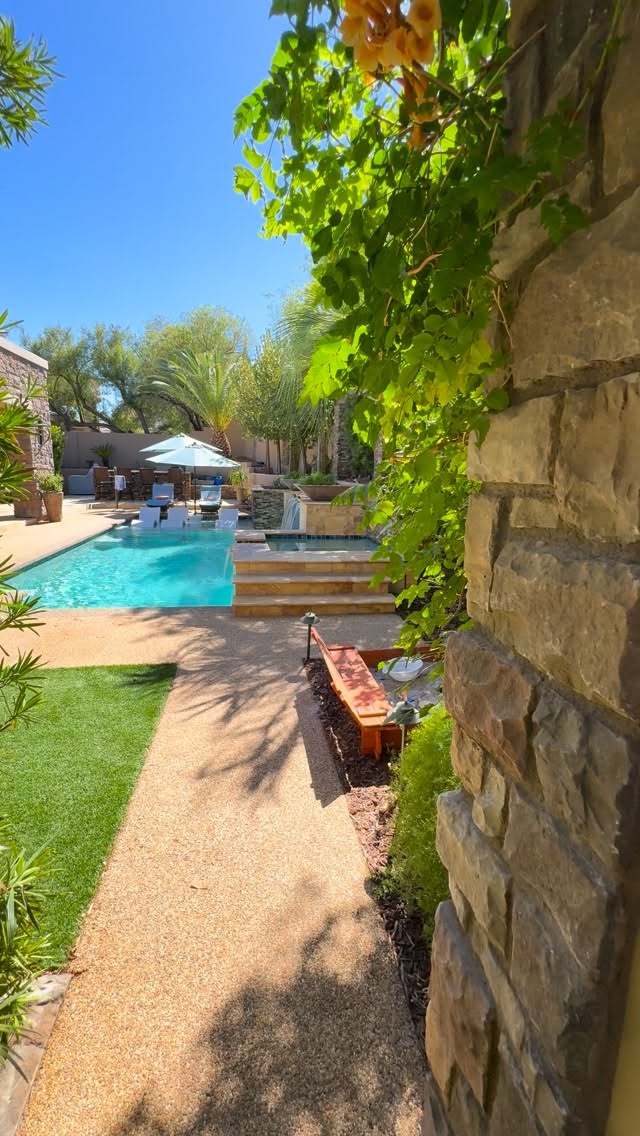 Canyon Fairways backyard with pool house, saltwater pool and outdoor kitchen — video tour